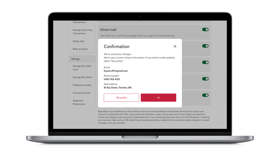 Laptop screen displaying confirmation page with the option to review contact details and select “Ok” or “My profile.”